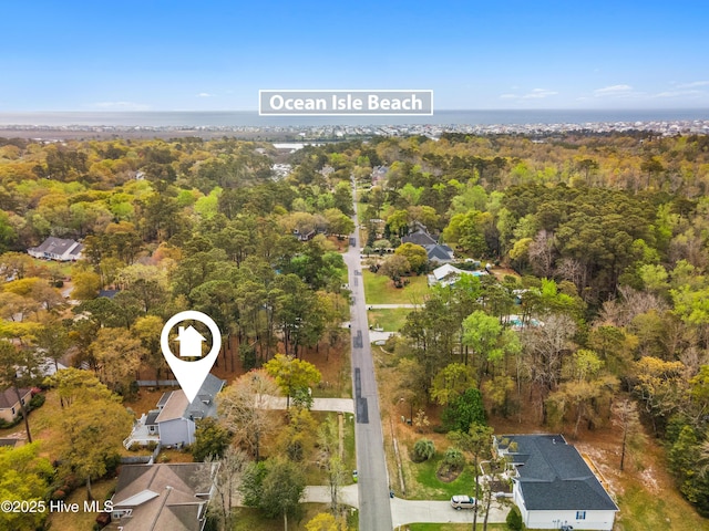 1611 Gores Landing Rd SW ., Unit Ocean Isle Beach, NC 28469 - birds eye view of property featuring a wooded view
