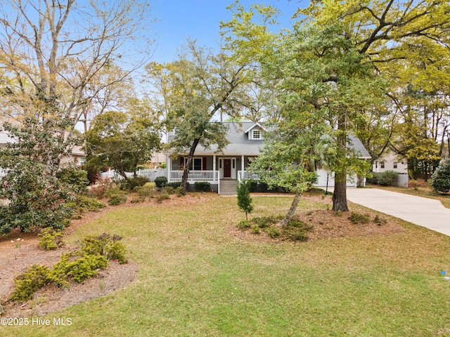 1611 Gores Landing Rd SW ., Unit Ocean Isle Beach, NC 28469 - view of front of home featuring a porch, concrete driveway, and a front lawn