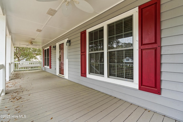 1611 Gores Landing Rd SW ., Unit Ocean Isle Beach, NC 28469 - deck with visible vents, a porch, and a ceiling fan