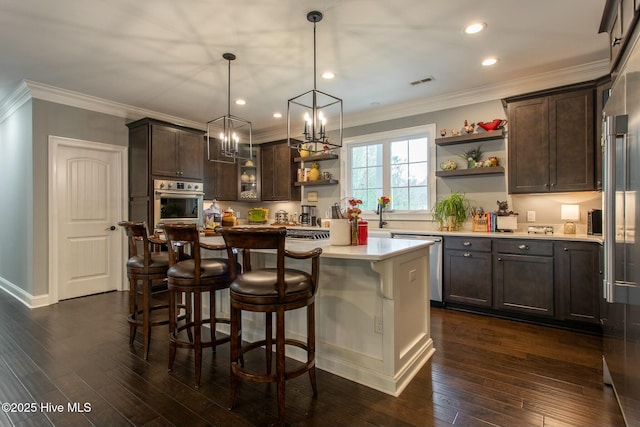 kitchen featuring stainless steel appliances, dark wood-style flooring, dark brown cabinetry, and open shelves