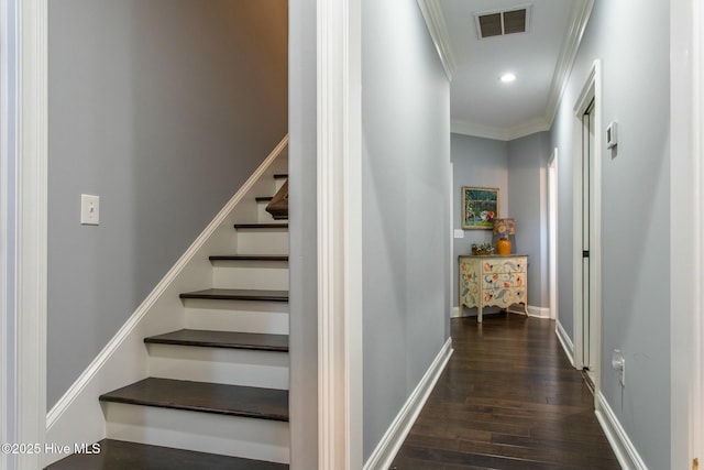 stairway featuring baseboards, visible vents, wood finished floors, crown molding, and recessed lighting