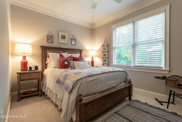 bedroom with a ceiling fan, baseboards, crown molding, and light colored carpet