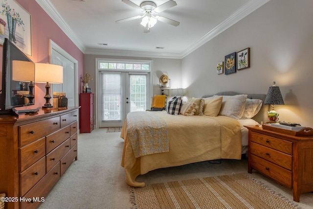 bedroom with light colored carpet, visible vents, access to outside, french doors, and ornamental molding