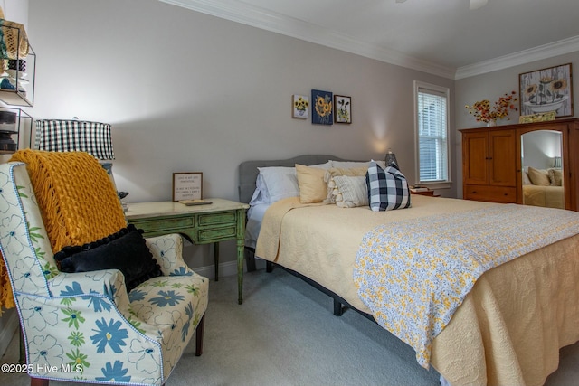 bedroom featuring carpet, crown molding, and baseboards