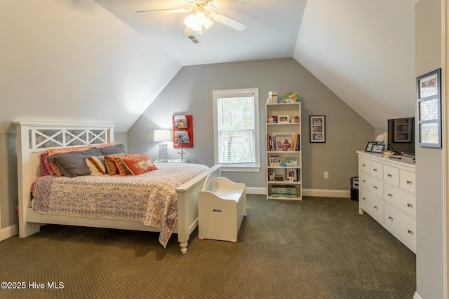 bedroom with a ceiling fan, dark colored carpet, vaulted ceiling, and baseboards