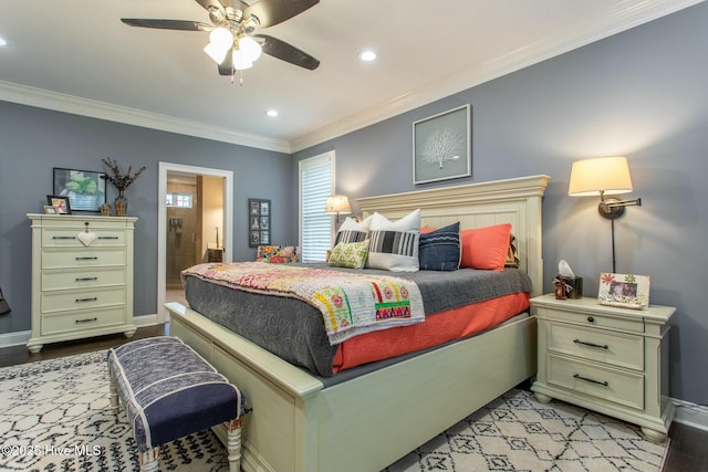 bedroom featuring baseboards, ornamental molding, connected bathroom, and recessed lighting