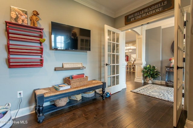 interior space with arched walkways, wood finished floors, baseboards, french doors, and ornamental molding