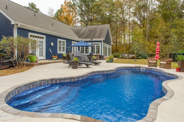 outdoor pool featuring a patio