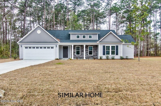 view of front facade with a garage, driveway, a front lawn, and roof with shingles