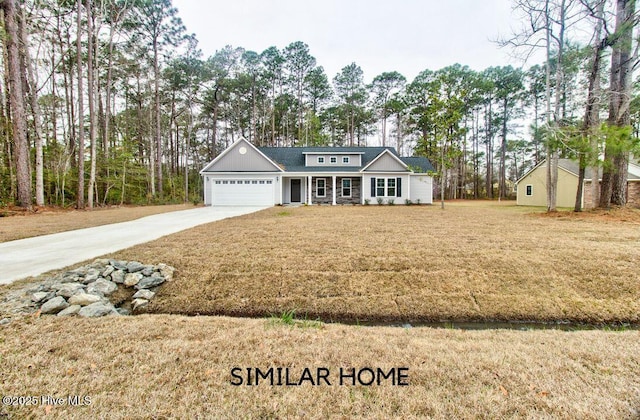 view of front facade with a garage, a front lawn, and concrete driveway