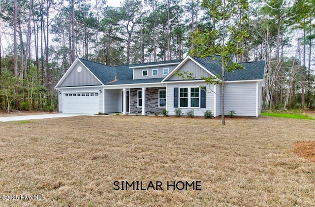 view of front facade with a garage, concrete driveway, stone siding, roof with shingles, and a front yard