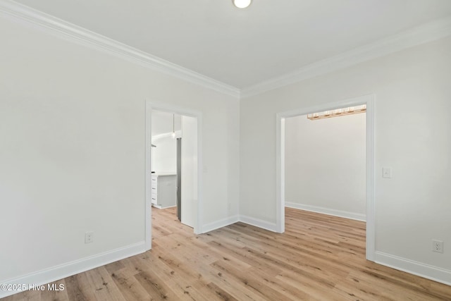 7103 E Yacht Dr, Oak Island, NC 28465 - unfurnished room with light wood-type flooring, baseboards, and crown molding