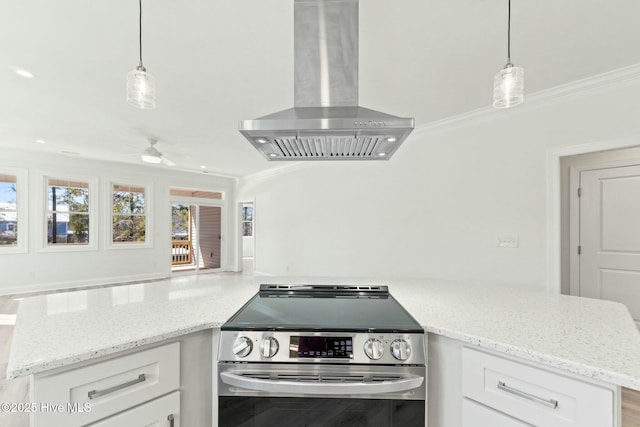 7103 E Yacht Dr, Oak Island, NC 28465 - kitchen featuring ornamental molding, a ceiling fan, stainless steel electric stove, white cabinetry, and wall chimney exhaust hood