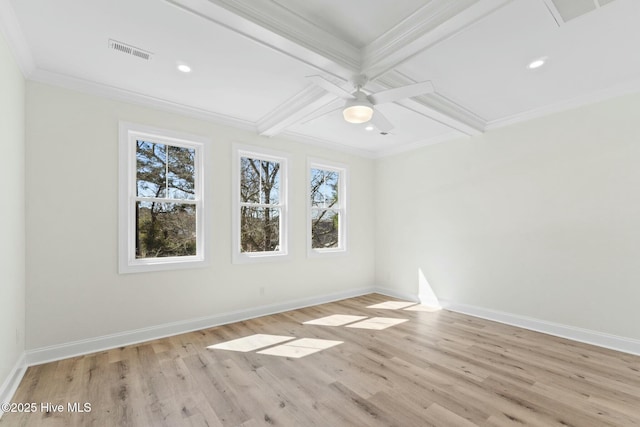 7103 E Yacht Dr, Oak Island, NC 28465 - spare room featuring visible vents, plenty of natural light, coffered ceiling, and baseboards
