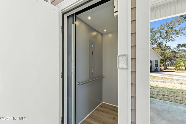 7103 E Yacht Dr, Oak Island, NC 28465 - elevator featuring wood finished floors and recessed lighting