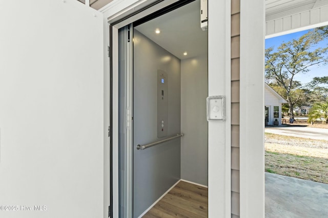 7103 E Yacht Dr, Oak Island, NC 28465 - room details featuring elevator and wood finished floors