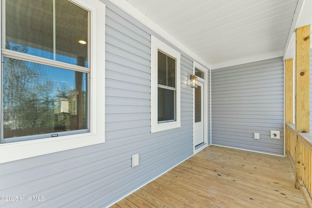 7103 E Yacht Dr, Oak Island, NC 28465 - wooden deck with covered porch