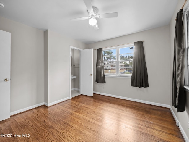 207 Cardinal Rd, Jacksonville, NC 28546 - unfurnished bedroom featuring wood finished floors, a ceiling fan, and baseboards