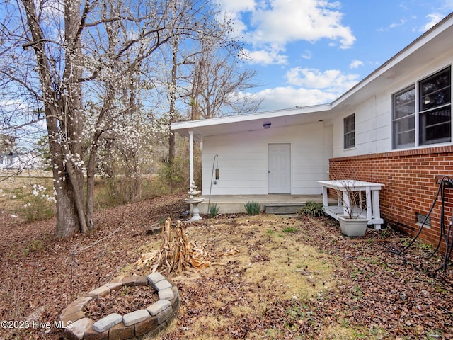 property entrance with brick siding