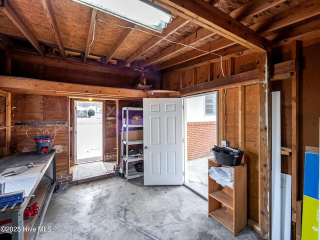 miscellaneous room featuring unfinished concrete flooring