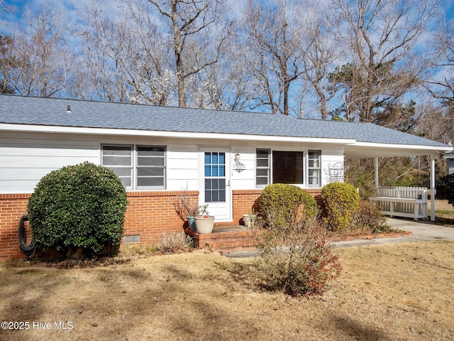 single story home with crawl space, driveway, a carport, and brick siding