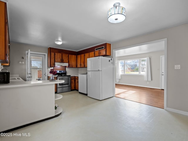 kitchen with dishwasher, light floors, freestanding refrigerator, stainless steel electric stove, and under cabinet range hood