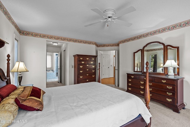 bedroom with ceiling fan and carpet floors