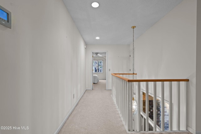 hallway featuring recessed lighting and carpet floors