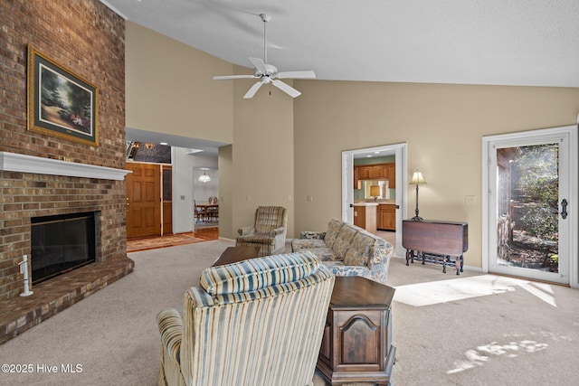 carpeted living area featuring high vaulted ceiling, ceiling fan, and a fireplace