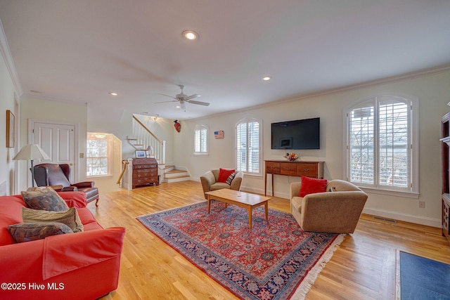 living room with visible vents, wood finished floors, stairs, crown molding, and recessed lighting