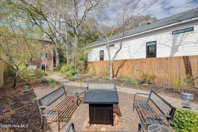 view of patio / terrace featuring fence