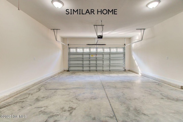 garage with baseboards and a garage door opener