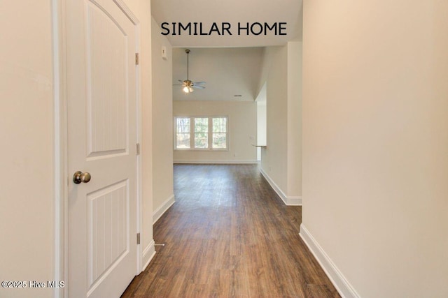 hall featuring baseboards and dark wood-type flooring