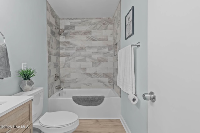 full bath featuring toilet, tub / shower combination, vanity, and wood finished floors