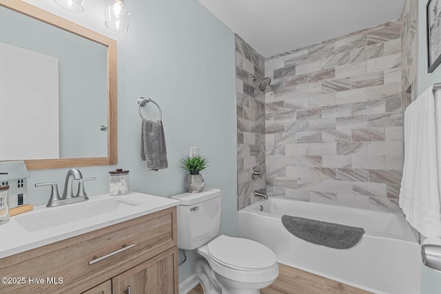 full bathroom with vanity, toilet, and washtub / shower combination