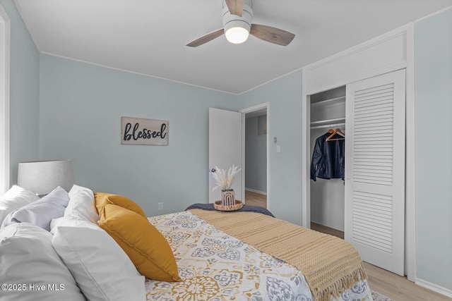 bedroom with a closet, ceiling fan, and light wood finished floors