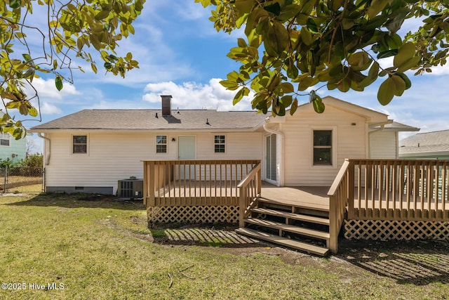 rear view of house with fence, a wooden deck, central AC, a lawn, and crawl space