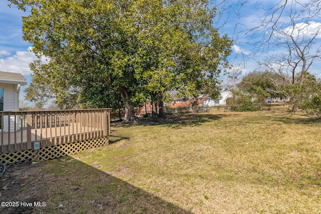 view of yard featuring a wooden deck