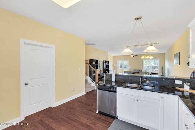 kitchen featuring dark wood-style floors, a sink, white cabinets, and stainless steel dishwasher