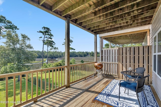 deck featuring a lawn