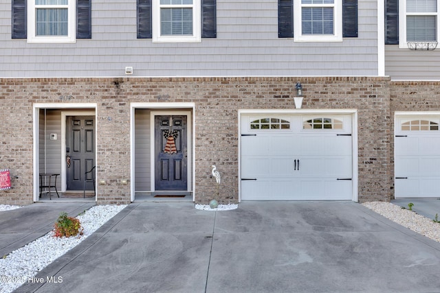 garage featuring driveway