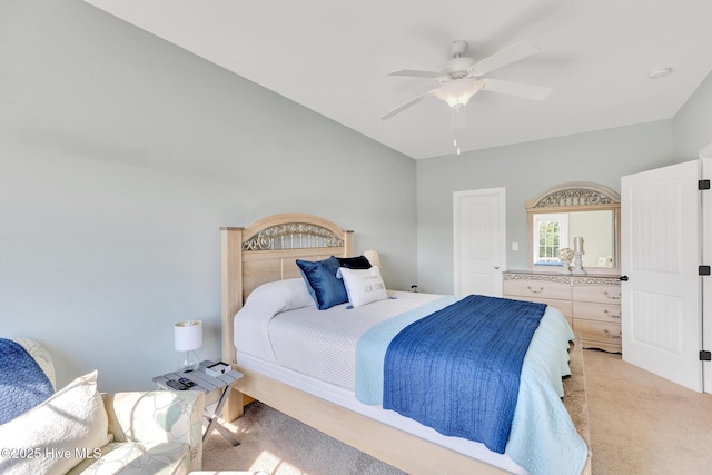 carpeted bedroom with a ceiling fan