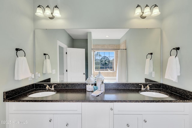 bathroom with double vanity and a sink