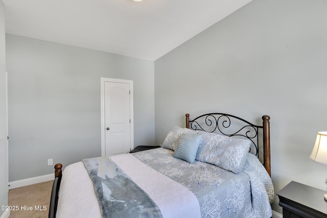 bedroom with baseboards and carpet floors