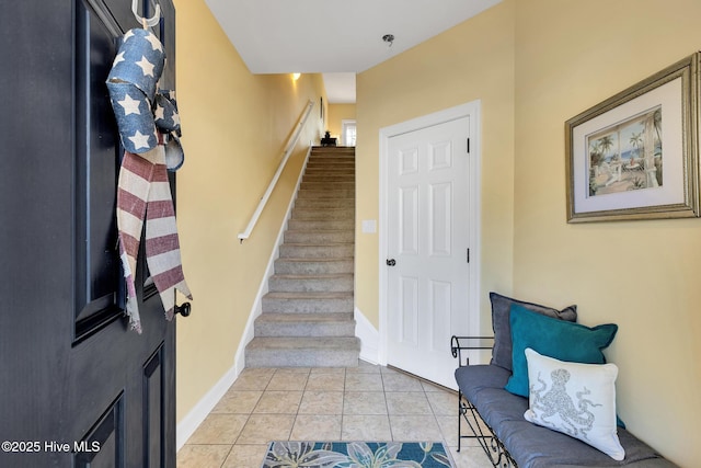 interior space featuring baseboards and tile patterned flooring