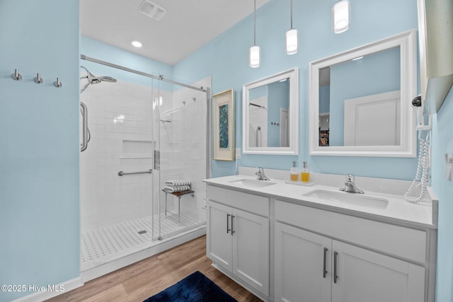 400 Frida Rd, New Bern, NC 28560 - full bathroom featuring a shower stall, wood finished floors, and double vanity