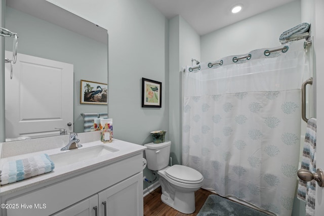 400 Frida Rd, New Bern, NC 28560 - bathroom featuring wood finished floors, vanity, toilet, and a shower with curtain
