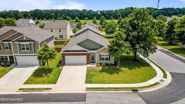 400 Frida Rd, New Bern, NC 28560 - view of front facade featuring driveway, brick siding, a front yard, and an attached garage