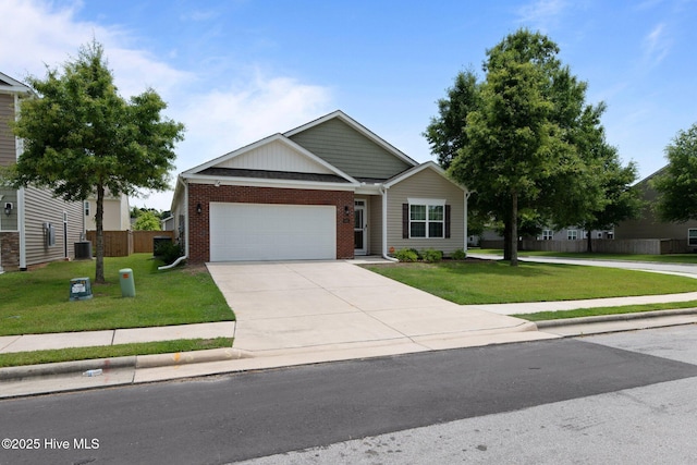 400 Frida Rd, New Bern, NC 28560 - view of front facade featuring an attached garage, concrete driveway, brick siding, and central AC