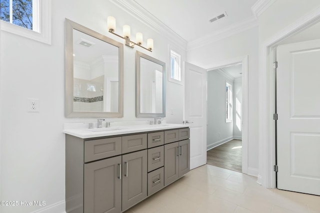 7105 E Yacht Dr, Oak Island, NC 28465 - full bathroom with visible vents, plenty of natural light, crown molding, and a sink